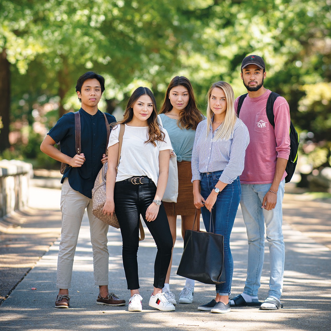 Five undergraduate students standing on Southern's campus.