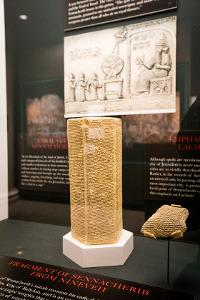 A replica of the Annals of Sennacherib and a fragment of the Annals of Sennacherib from a clay cylinder on loan from Yale University
