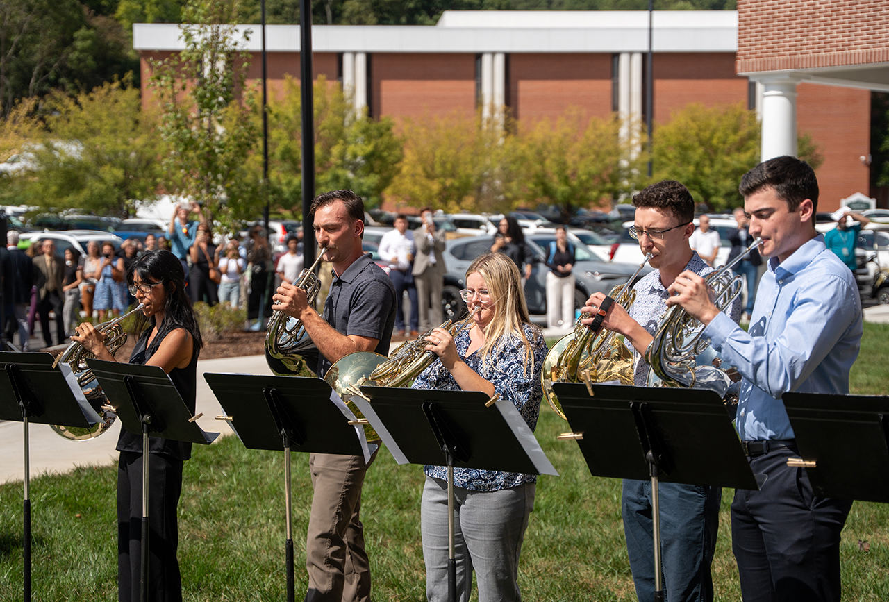 Student musicians perform at the Ruth McKee School of Business grand opening.