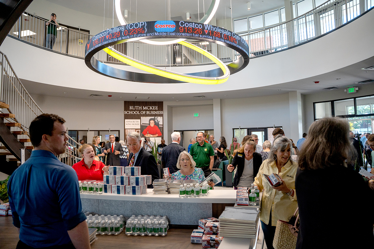 Guests explore the first floor lobby at the Ruth McKee School of Business grand opening.
