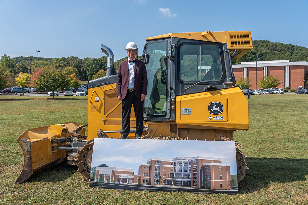 Ken shaw standing on a big machine