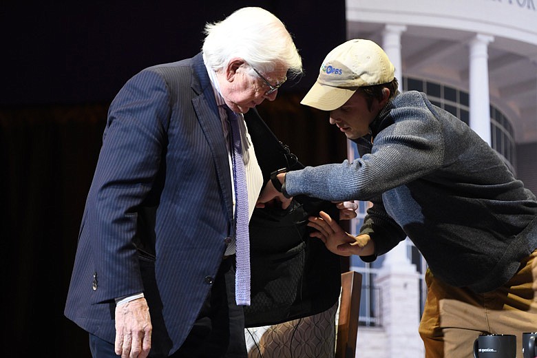 Carl Bernstein watches as his microphone is adjusted