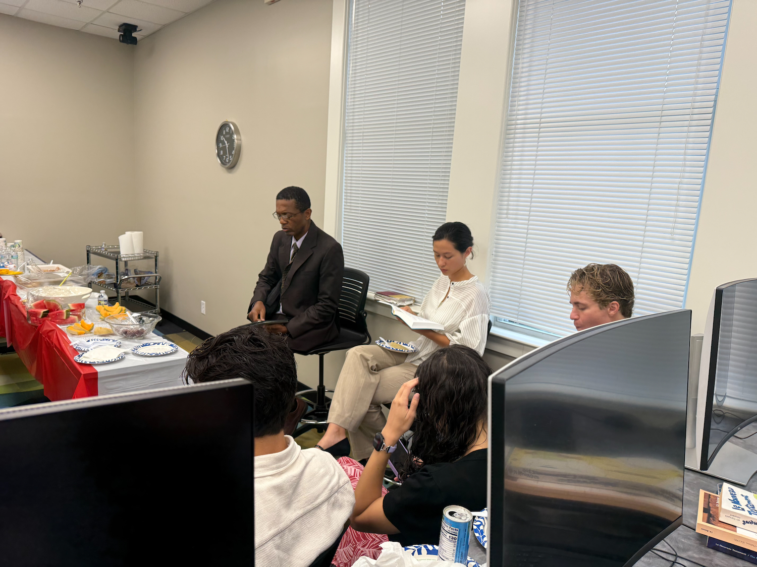 Three people sitting and talking