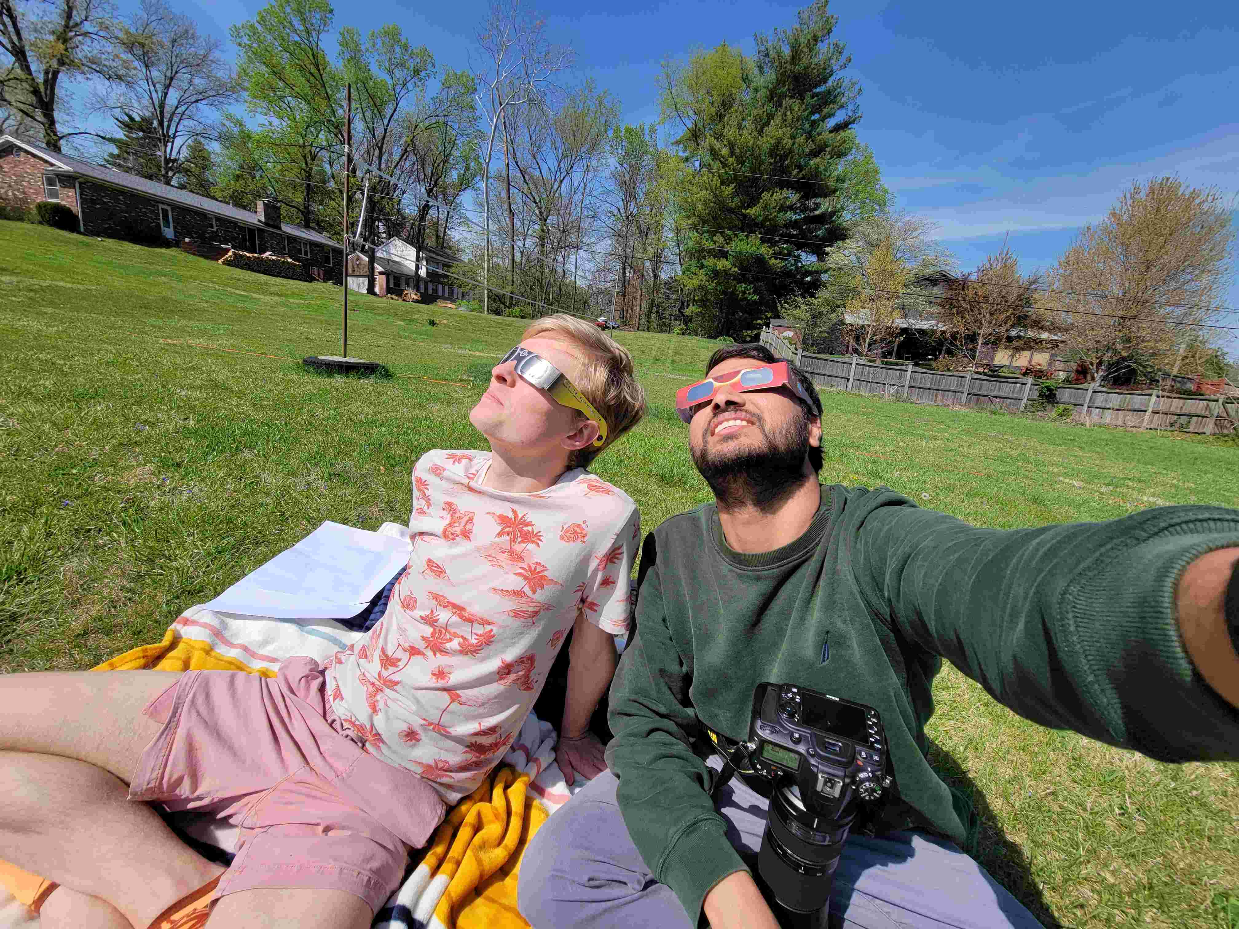 Image of two Physics students watching the eclipse 