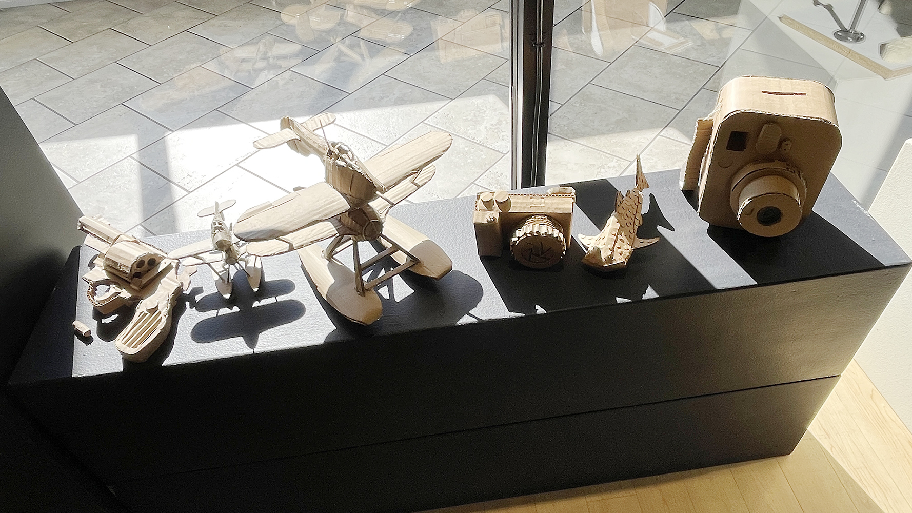 Cardboard objects made at varying scale 