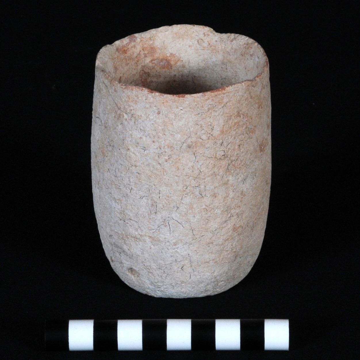 a beige cup with straight sides