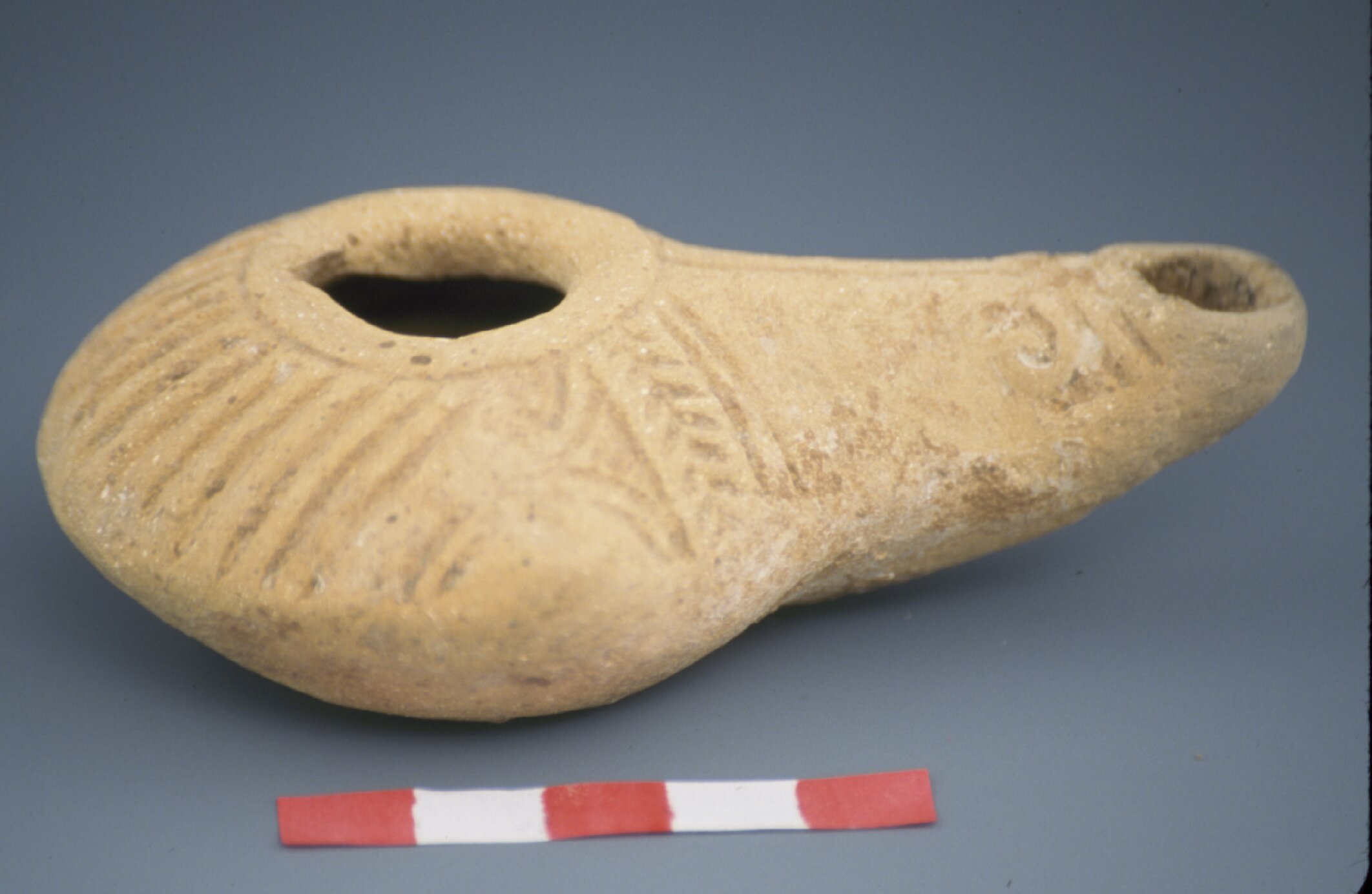 Delphini lamp with incised decoration