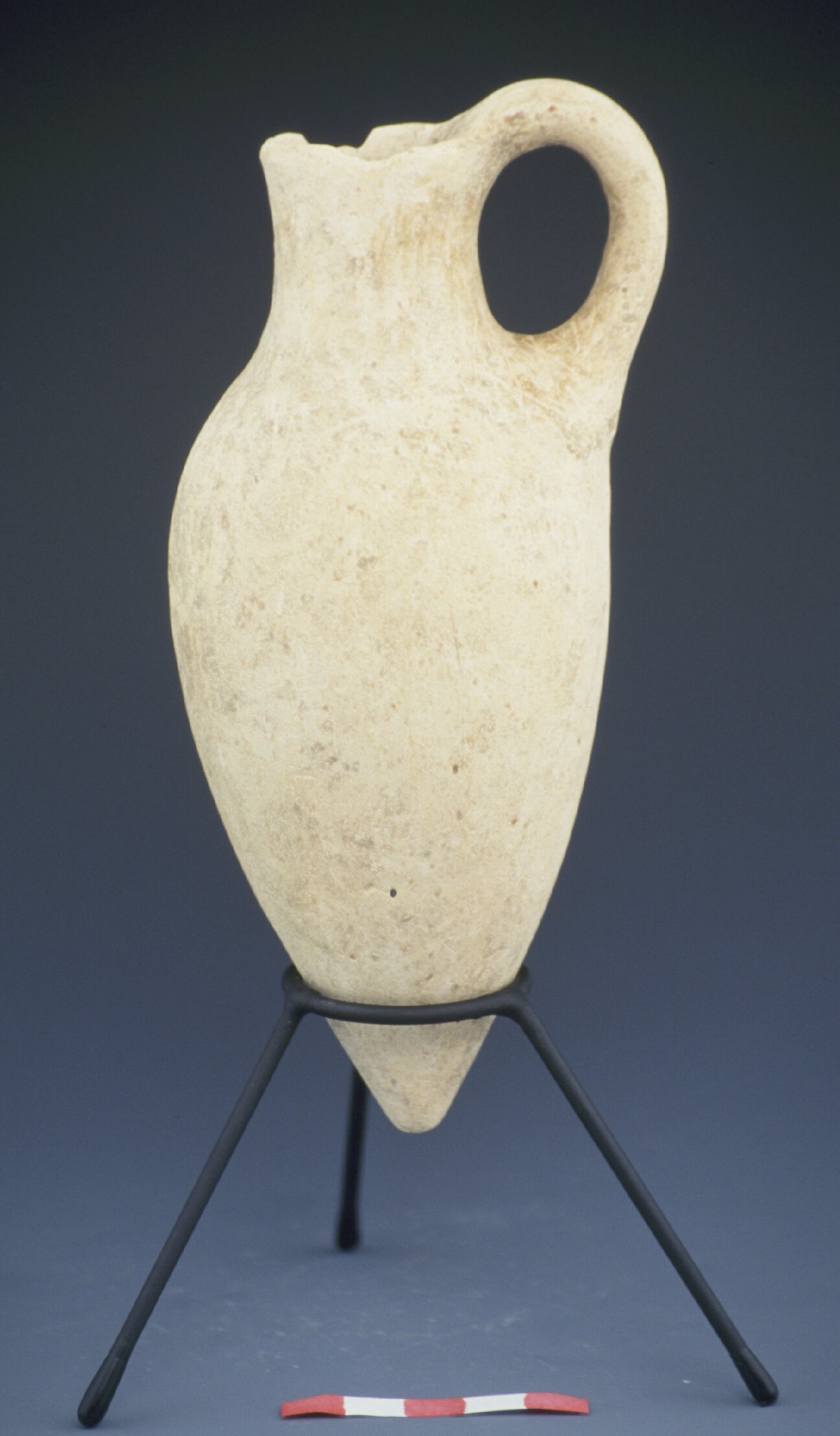 White shaved dipper juglet with circular impressions