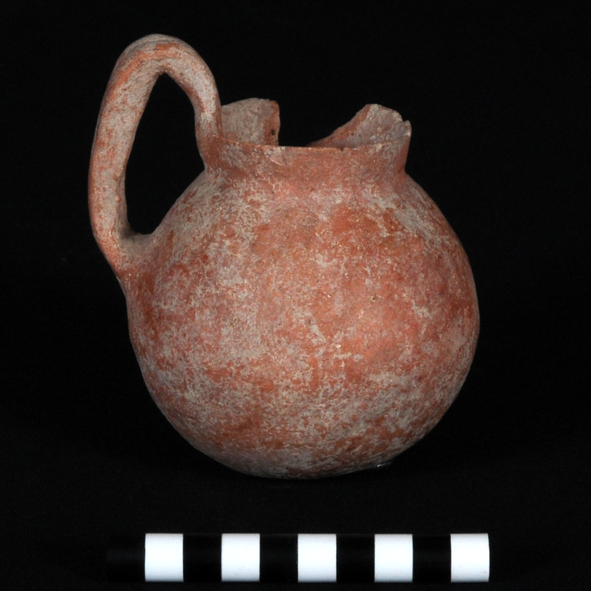 a reddish-brown high loop-handled cup