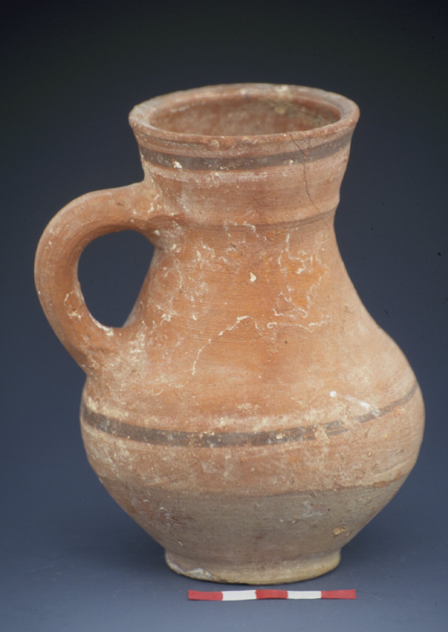 Jug with slightly mottled fabric and painted black/white lines