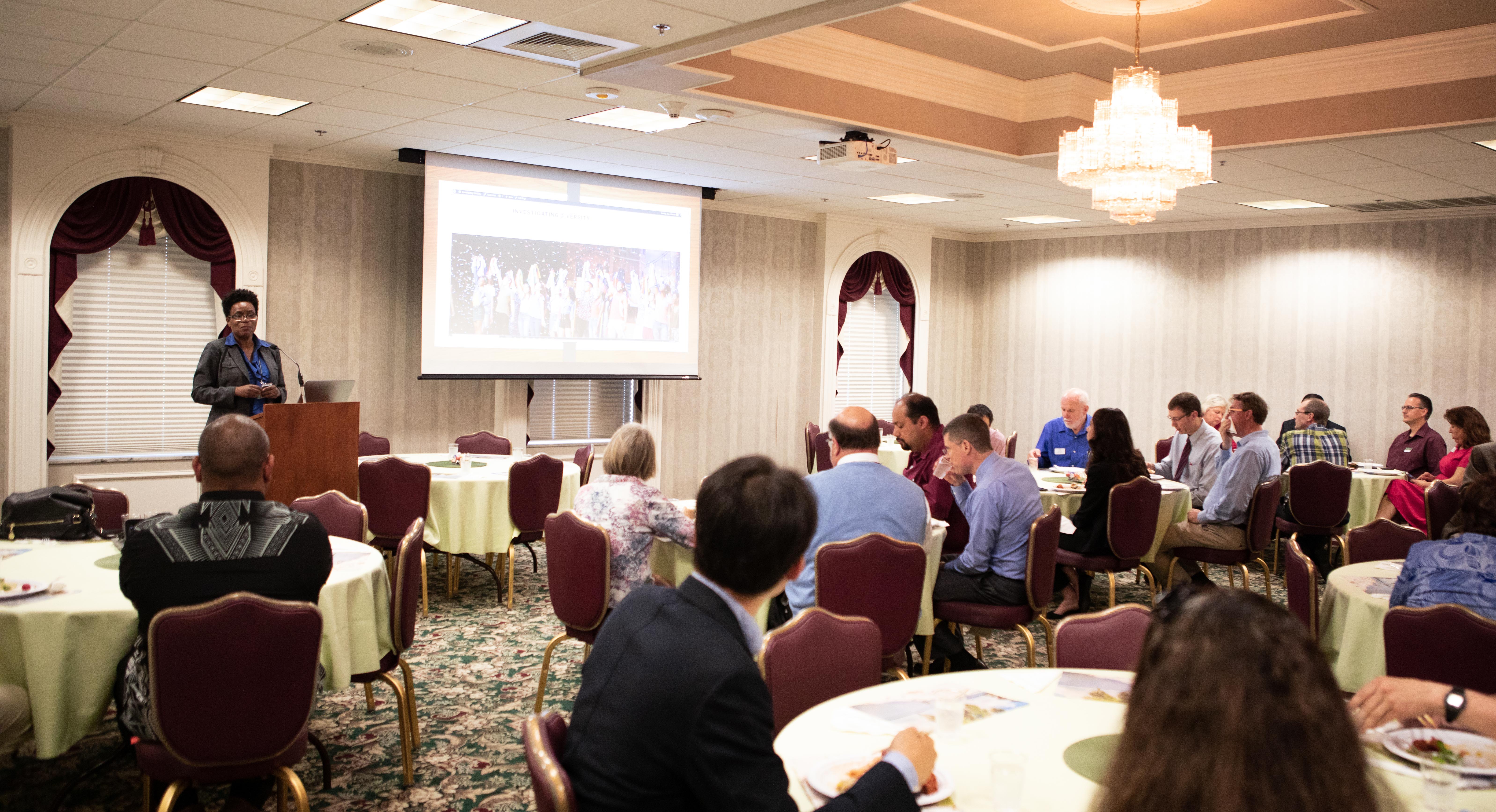 A crowd watching a presentation