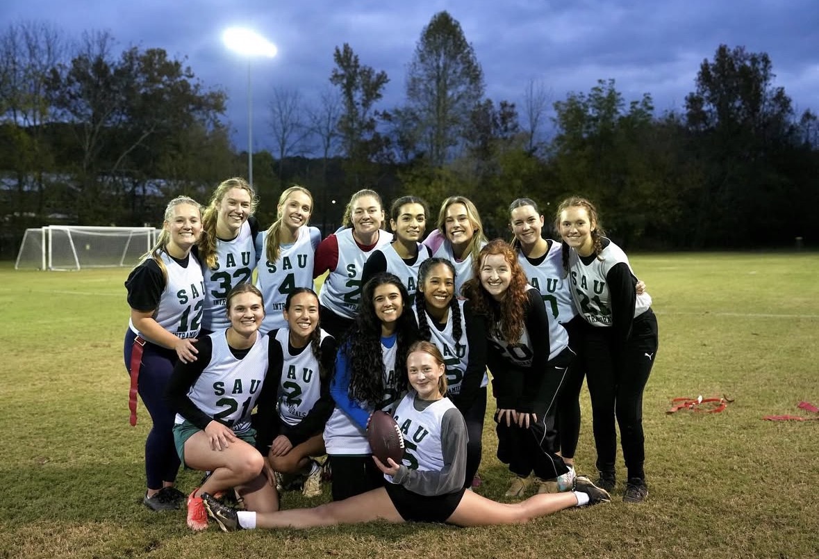 Blitz and Sacks posing on a field after winning the championship