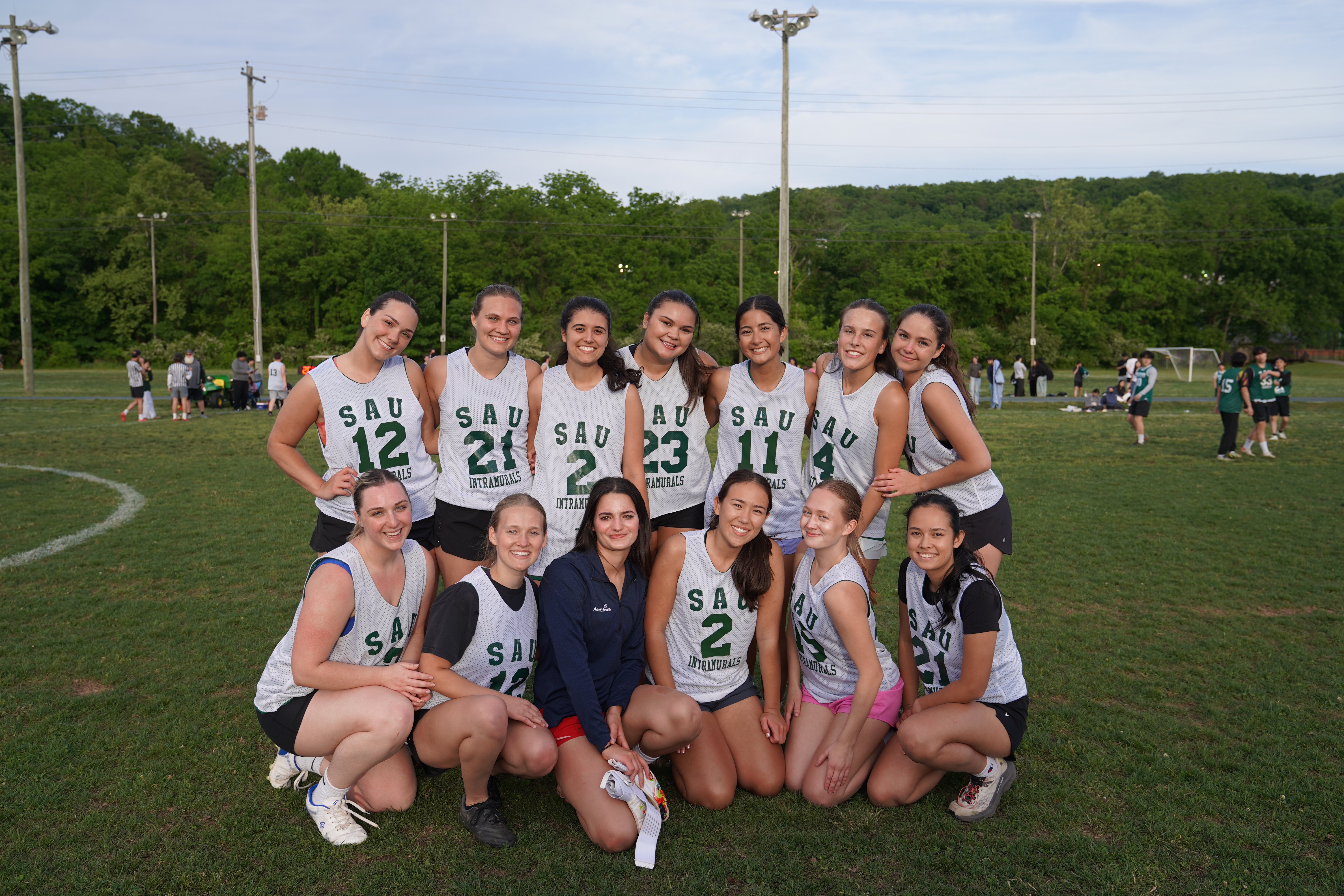 KenShawties posing on a field after winning the championship