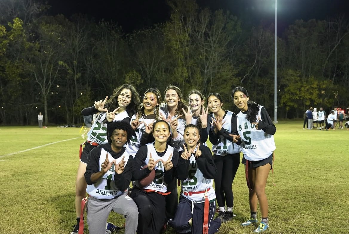 LowkeyDown posing on a field after winning the championship