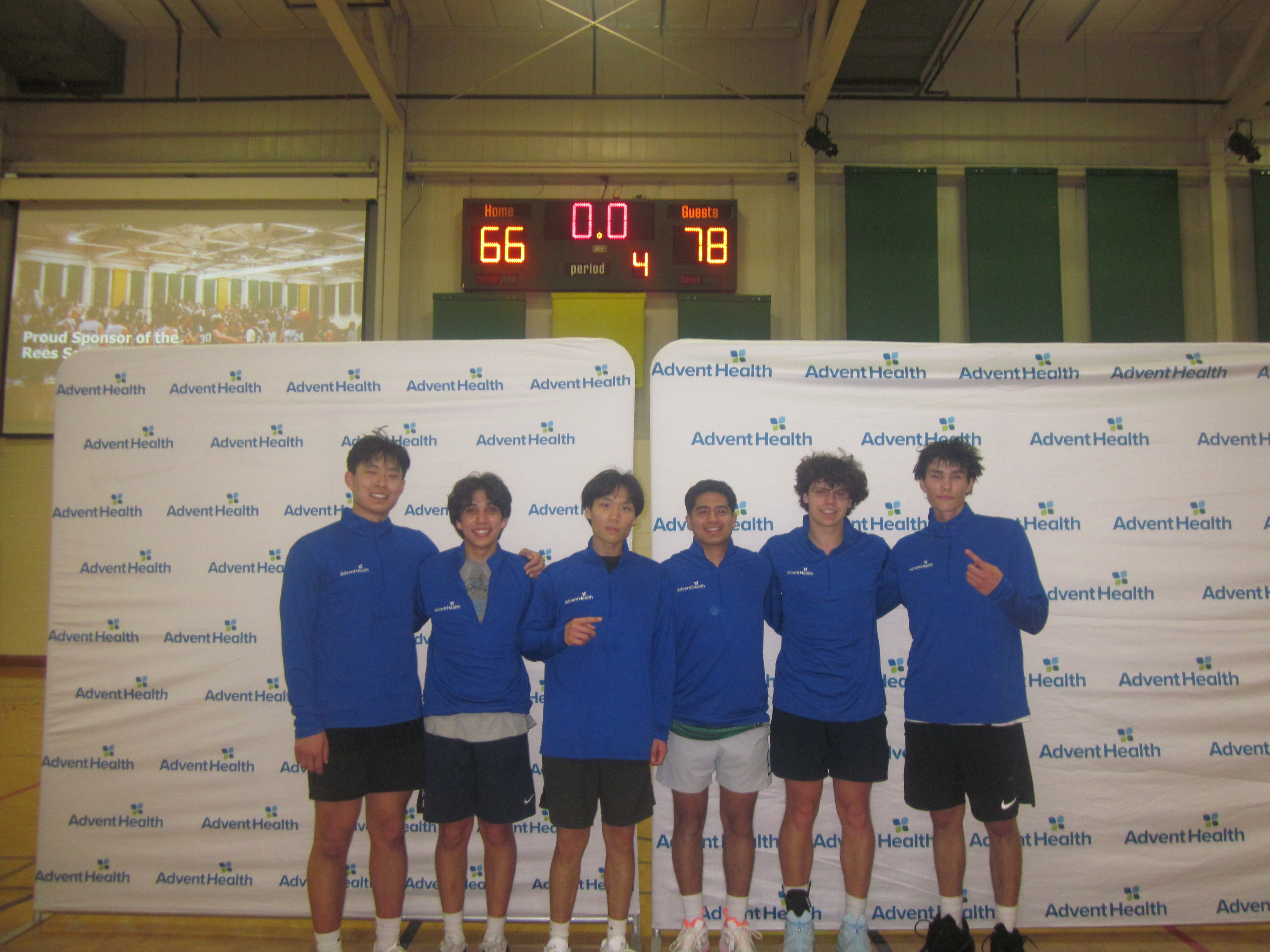 Moggers posing on a court after winning the championship