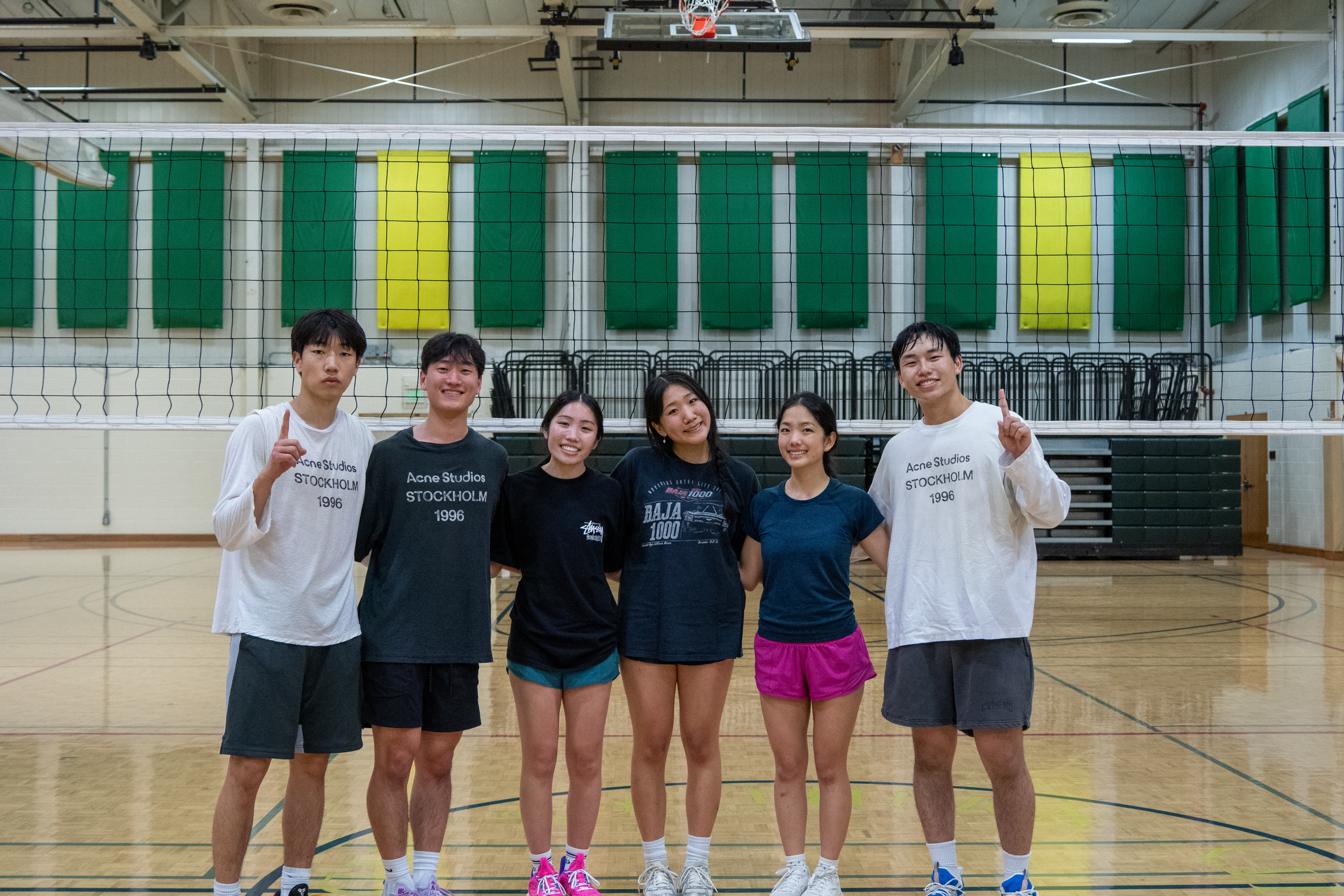 Monmgs posing on a court after winning the championship