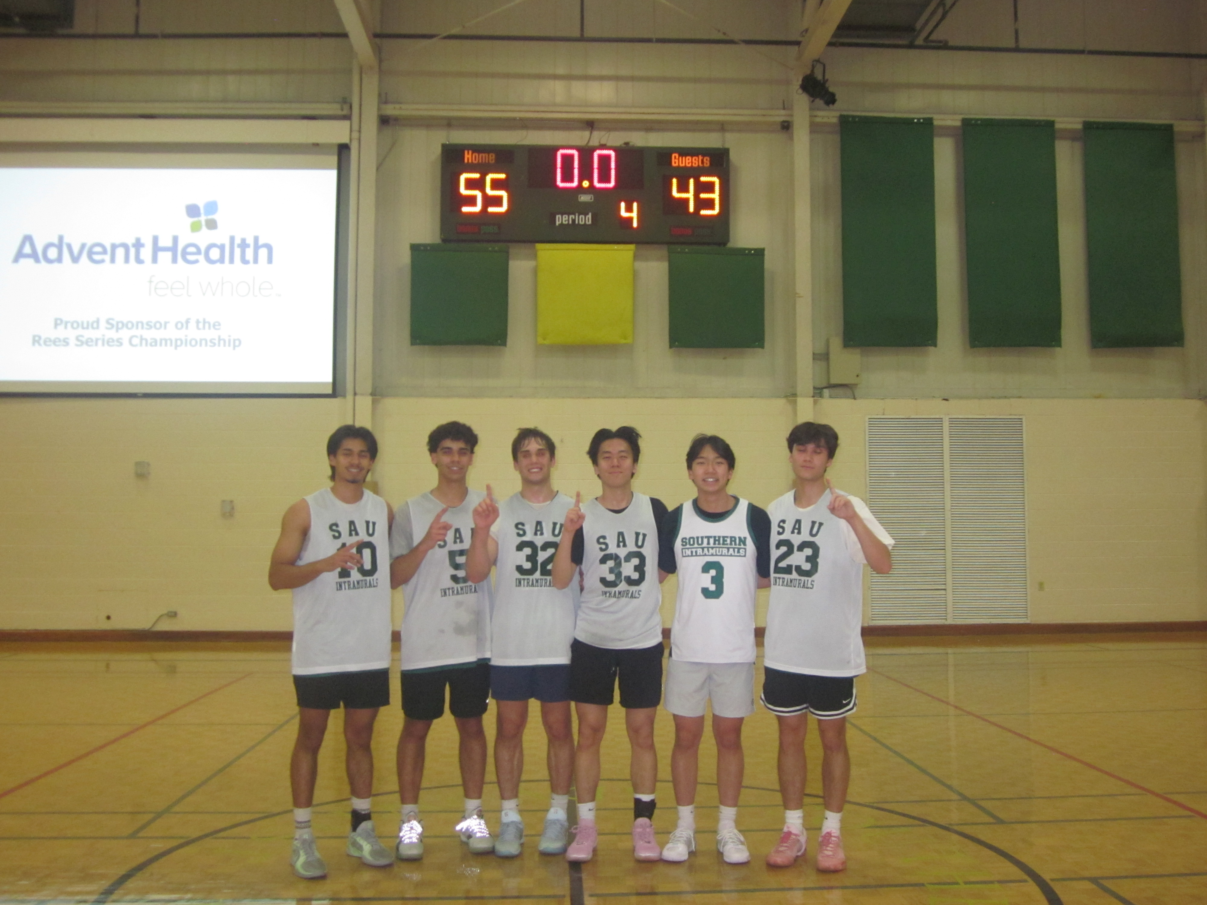 NeverPlayed posing on a court after winning the championship