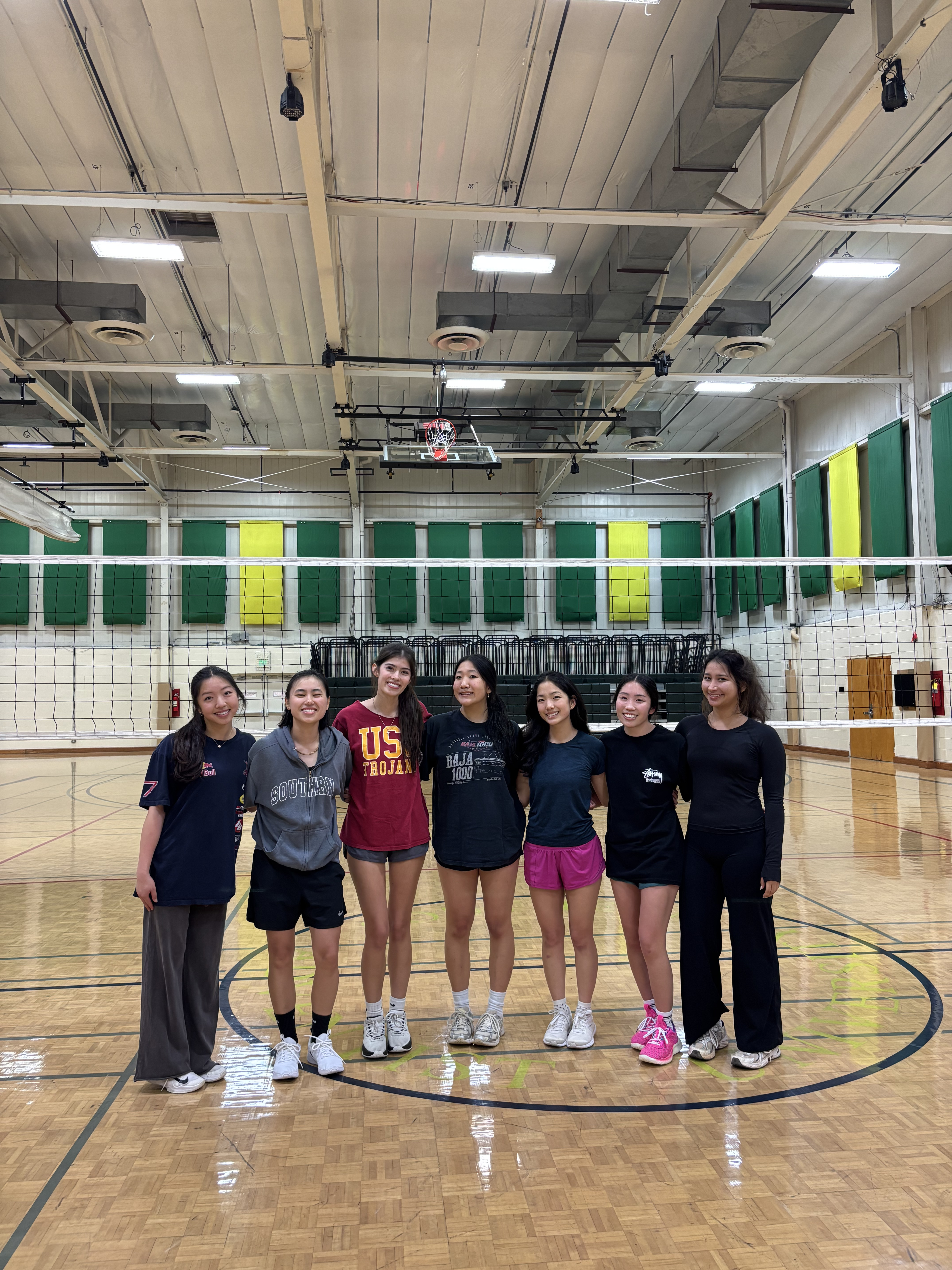 SheBall posing on a court after winning the championship