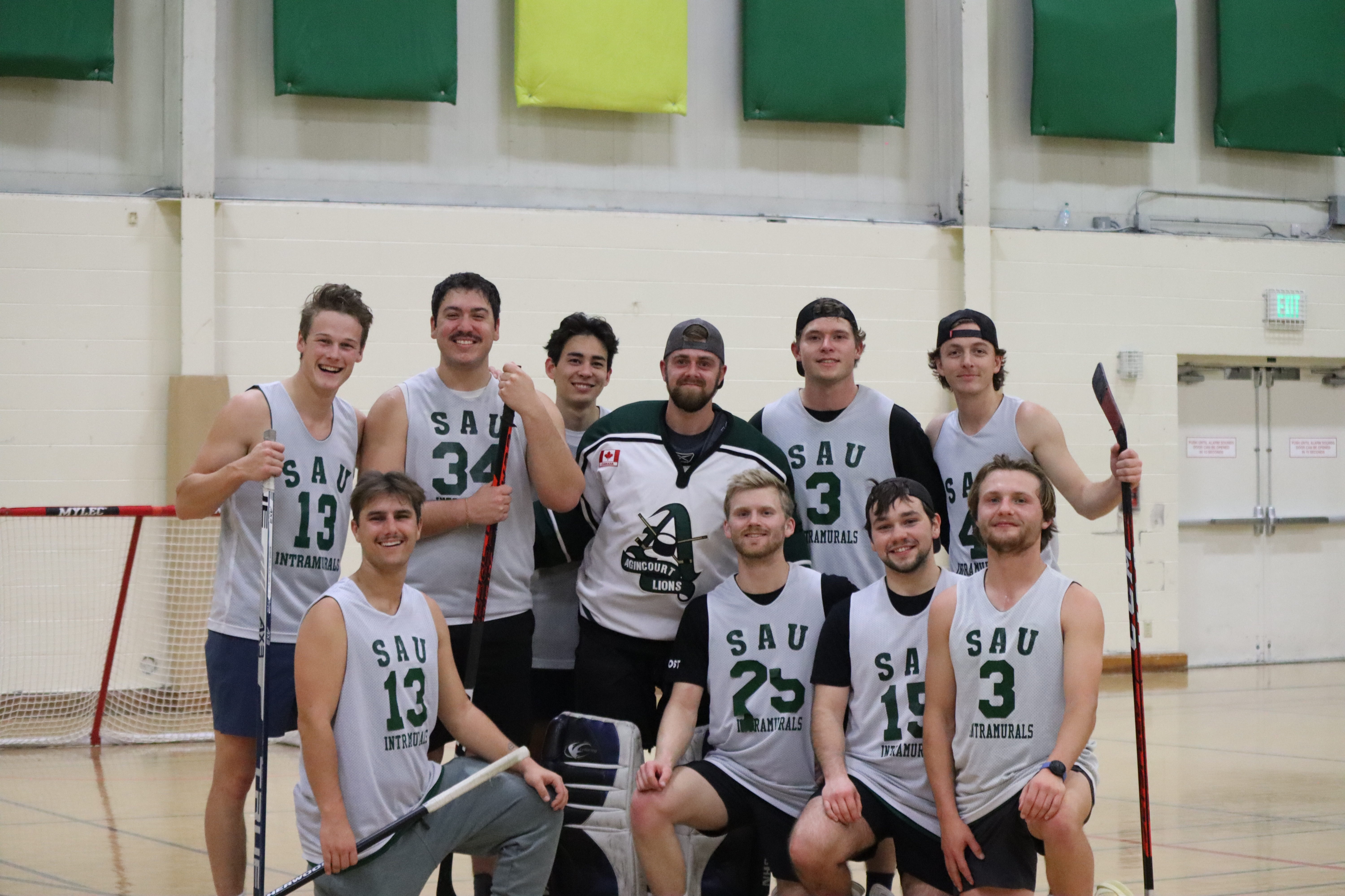 The Mountie Patrol posing on a court after winning the championship