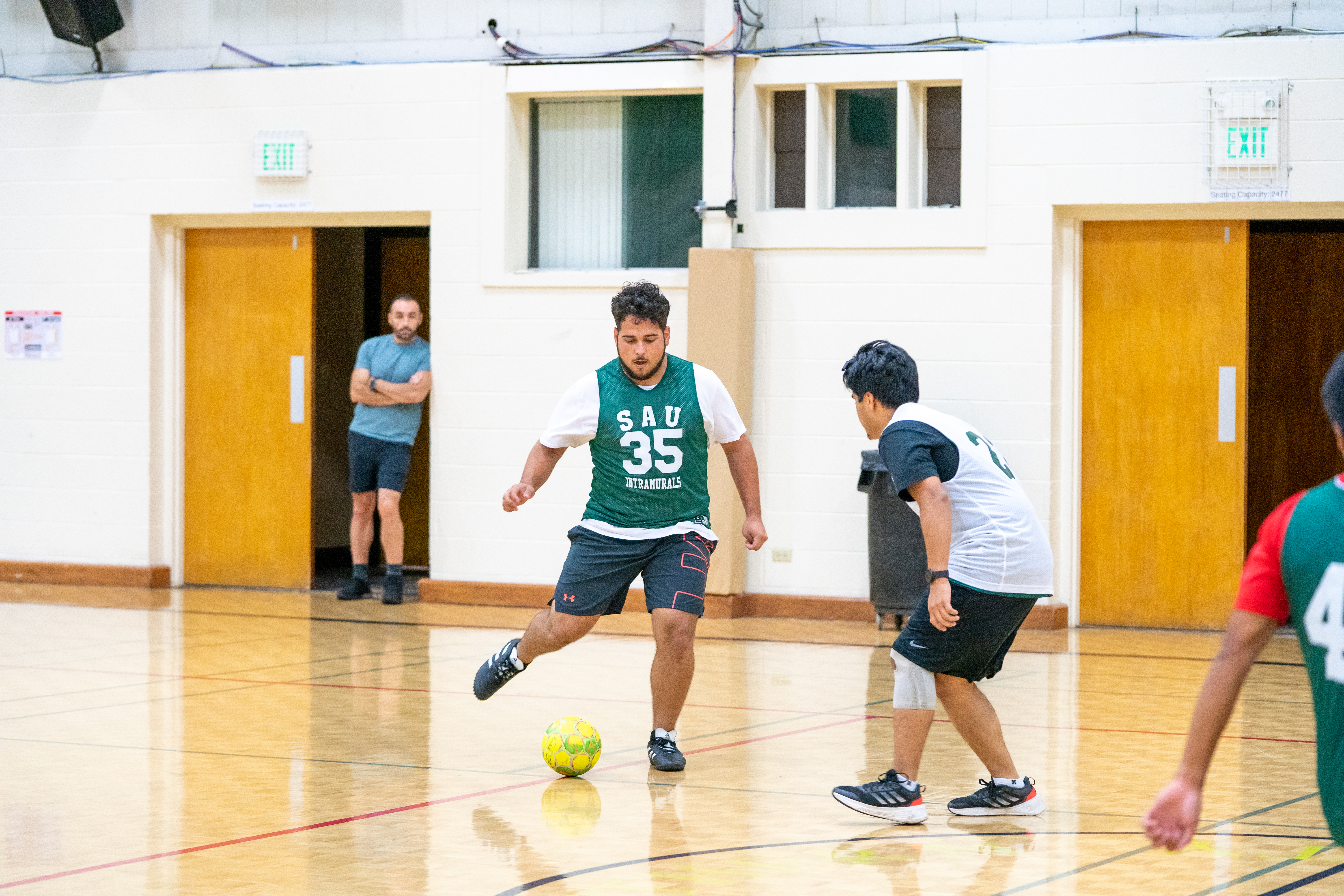Soccer player aims to kick a ball