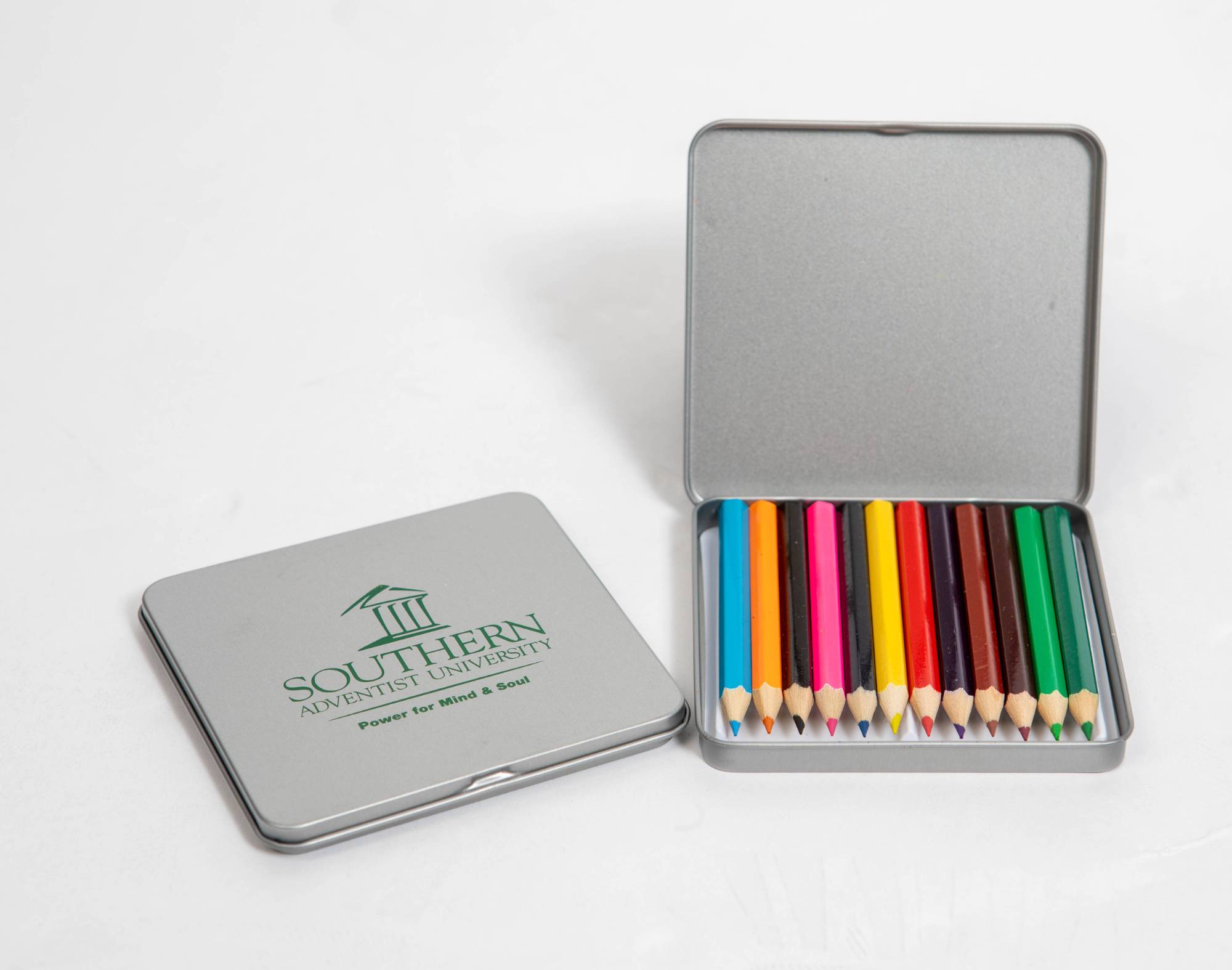 Pocket sized color pencils inside silver Southern branded tin