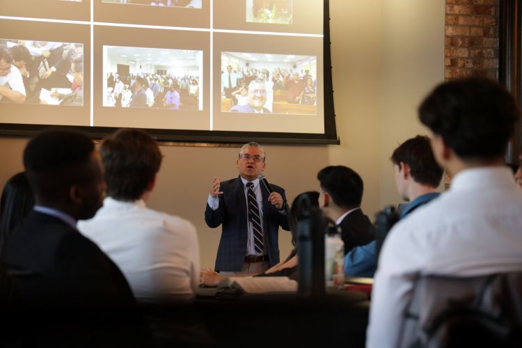 Pastor Rivero sharing information