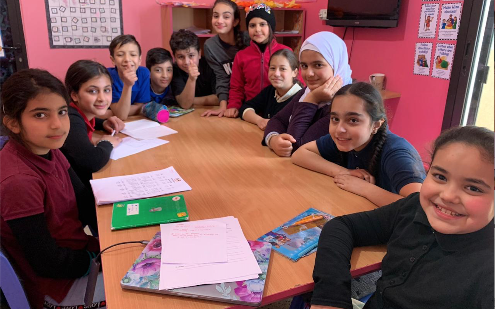 5th grade students gather to work on a group project