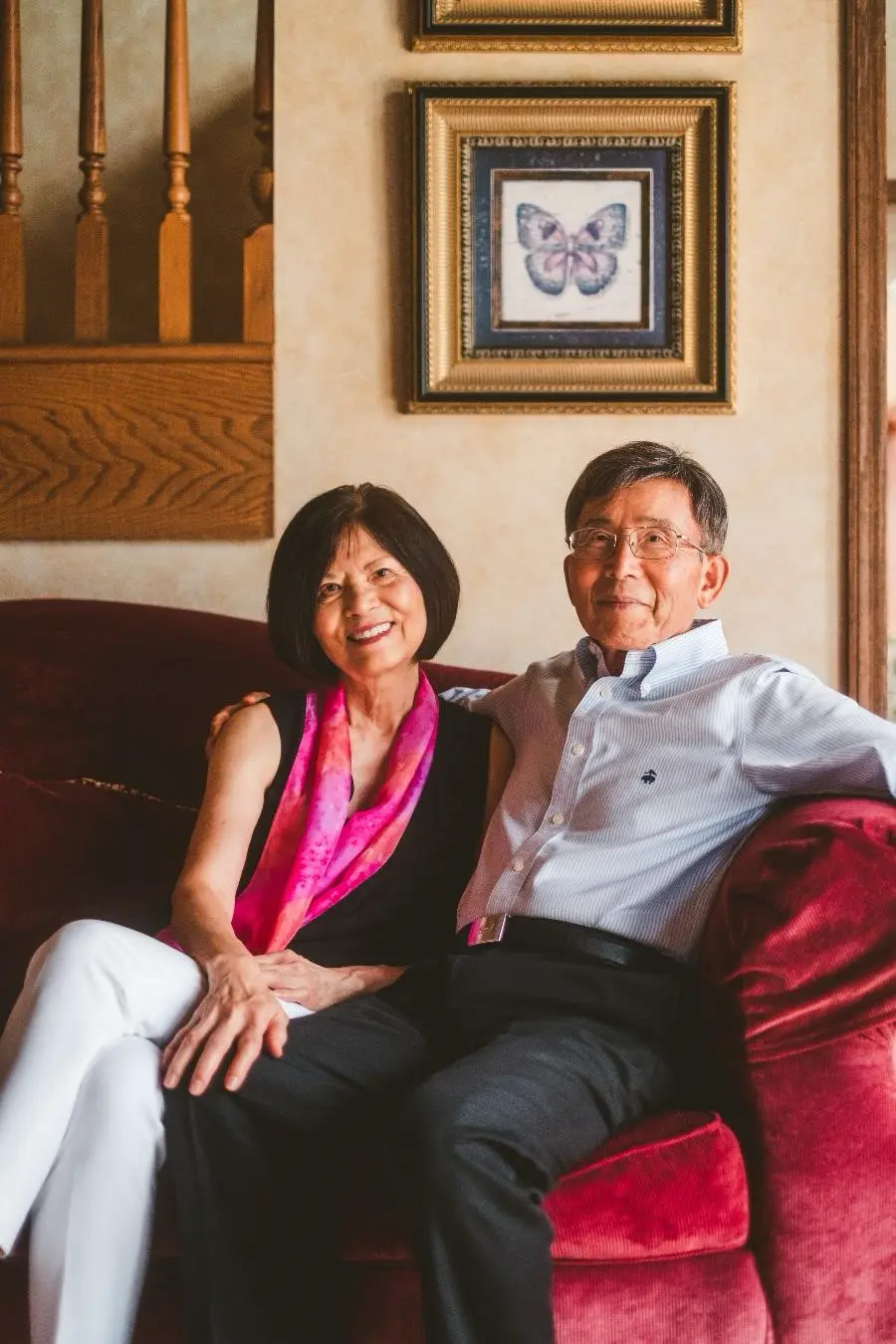 C.Y. & Ruth sitting together on a red couch
