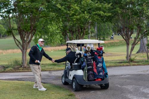 Golfers giving a handshake