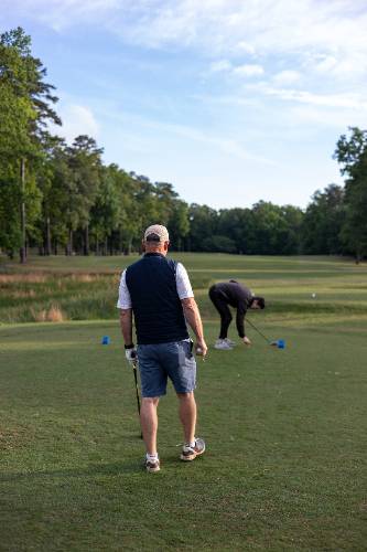 Golfers at the tee box