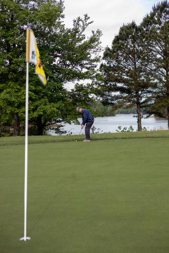 Golfer making a putt 