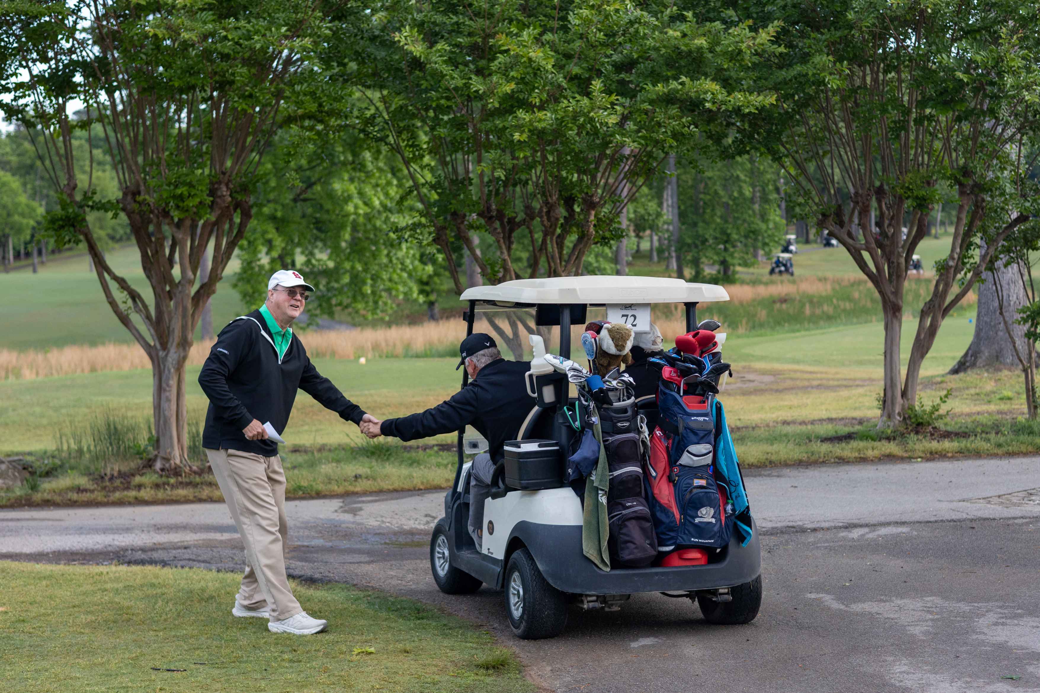 Two golfers passing by 