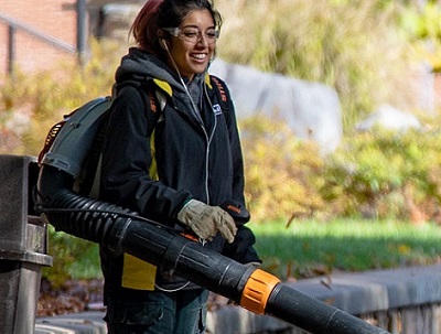 Student with leaf blower