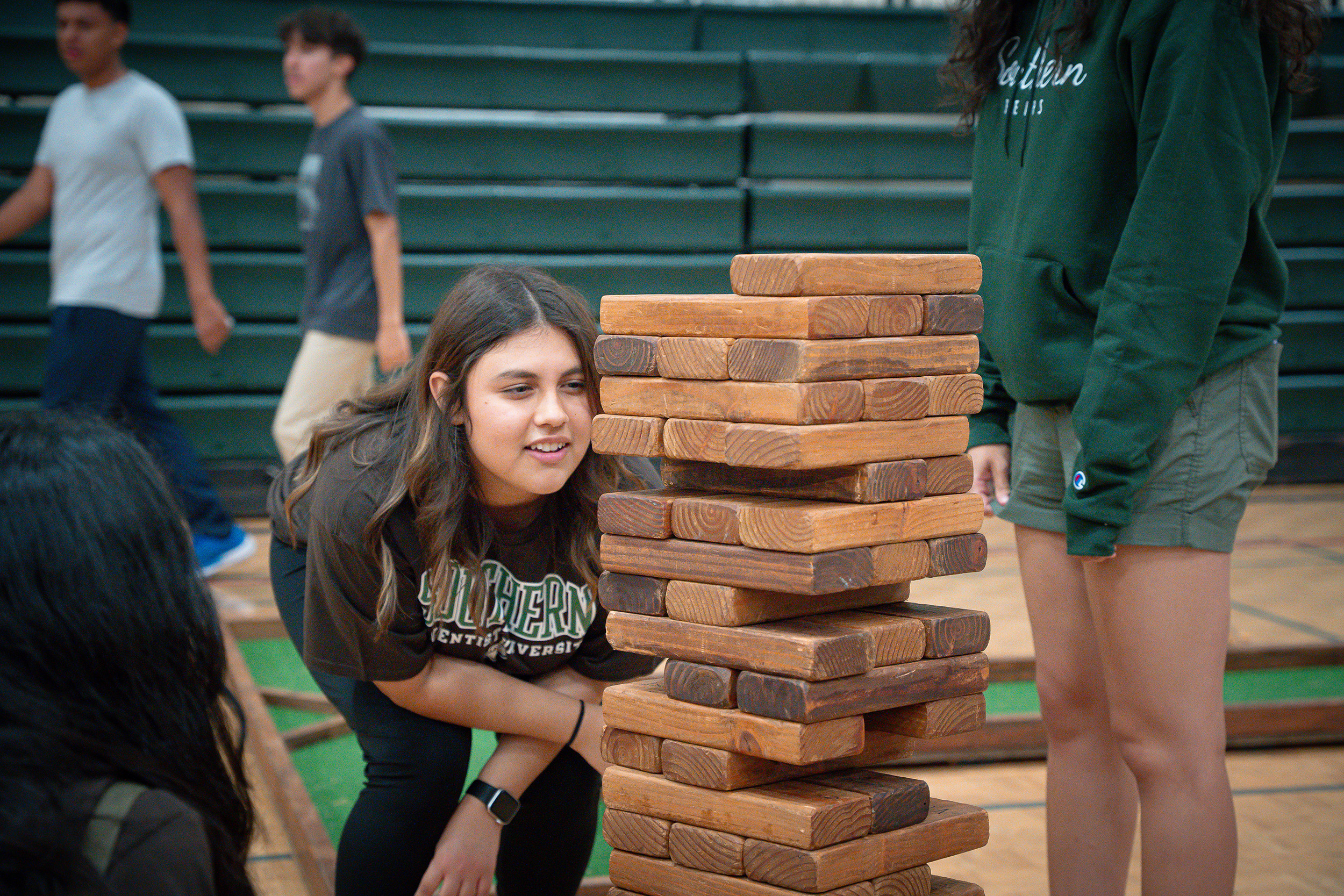 a student plays giant jenga