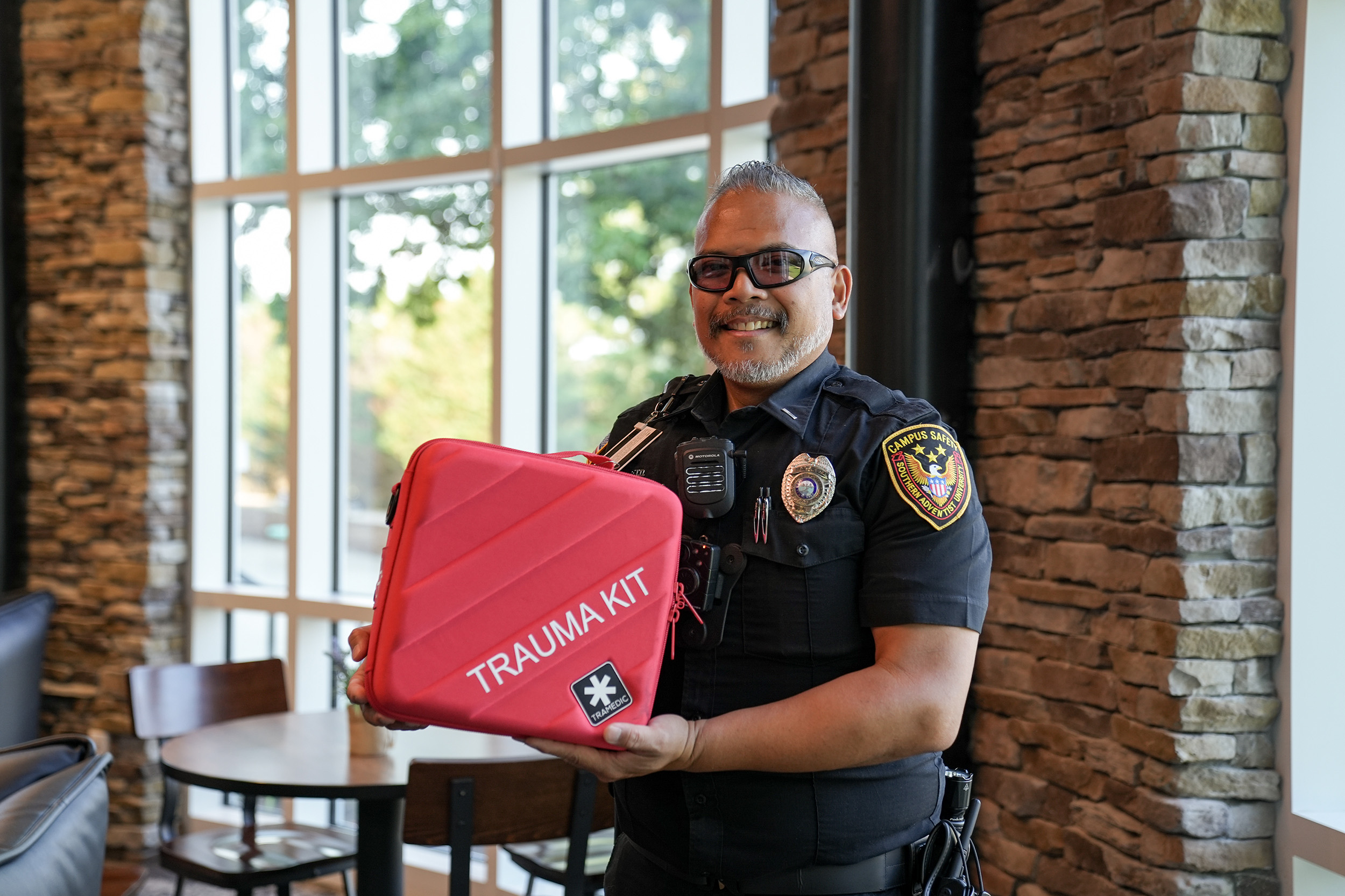a campus safety officer holds a trauma kit