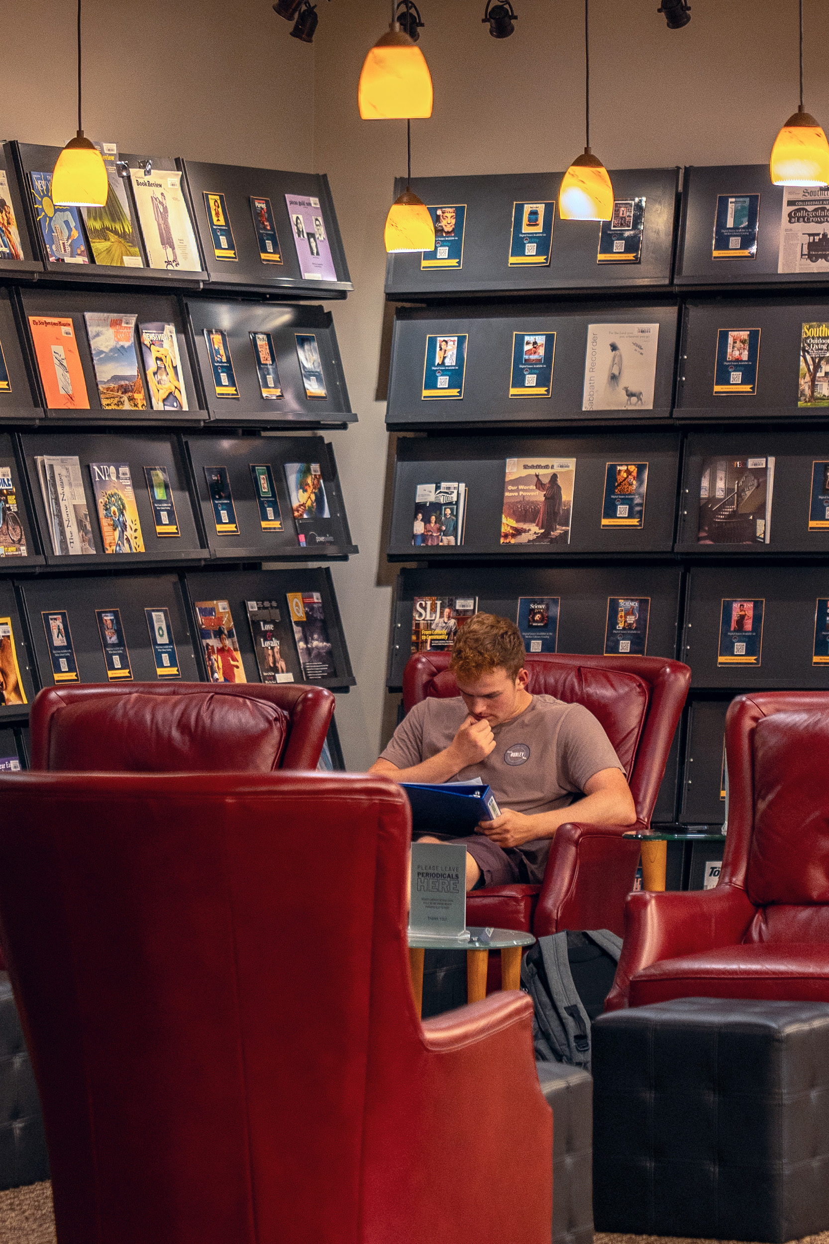 a student reads in the library