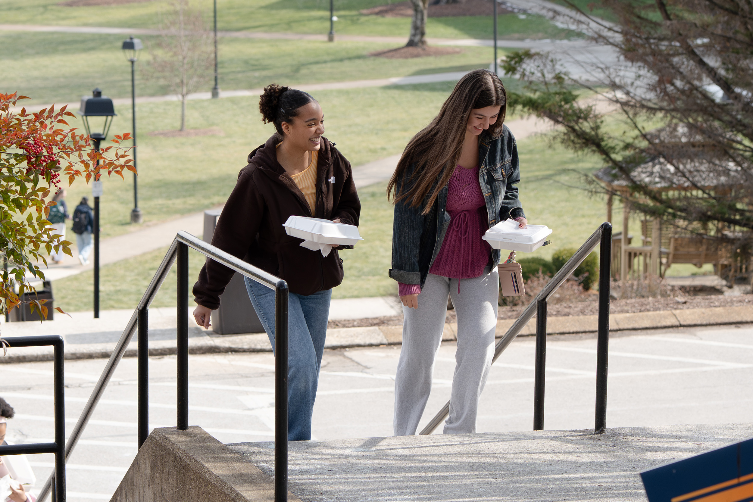 two students walking up the stairs