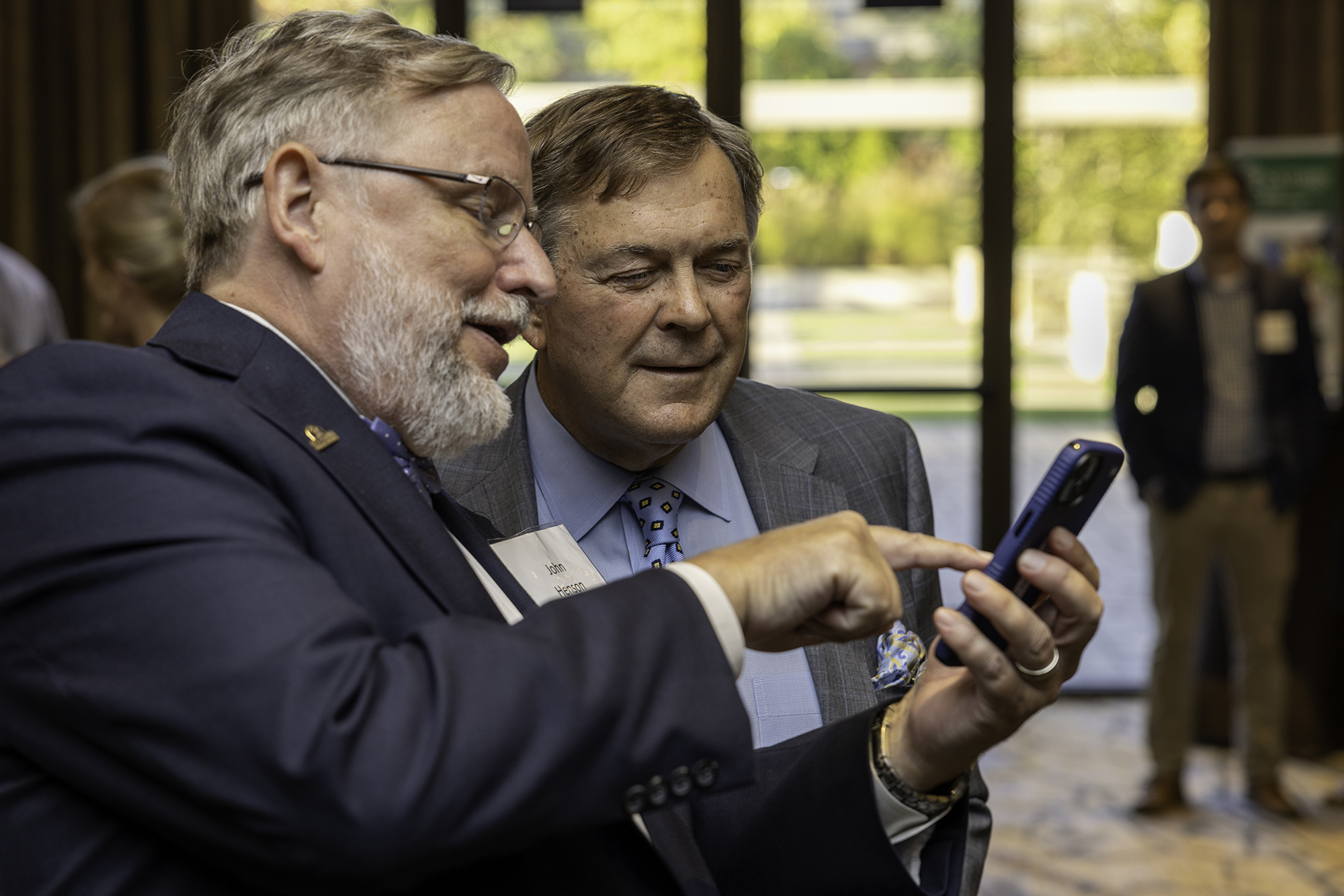 someone showing someone something on their phone