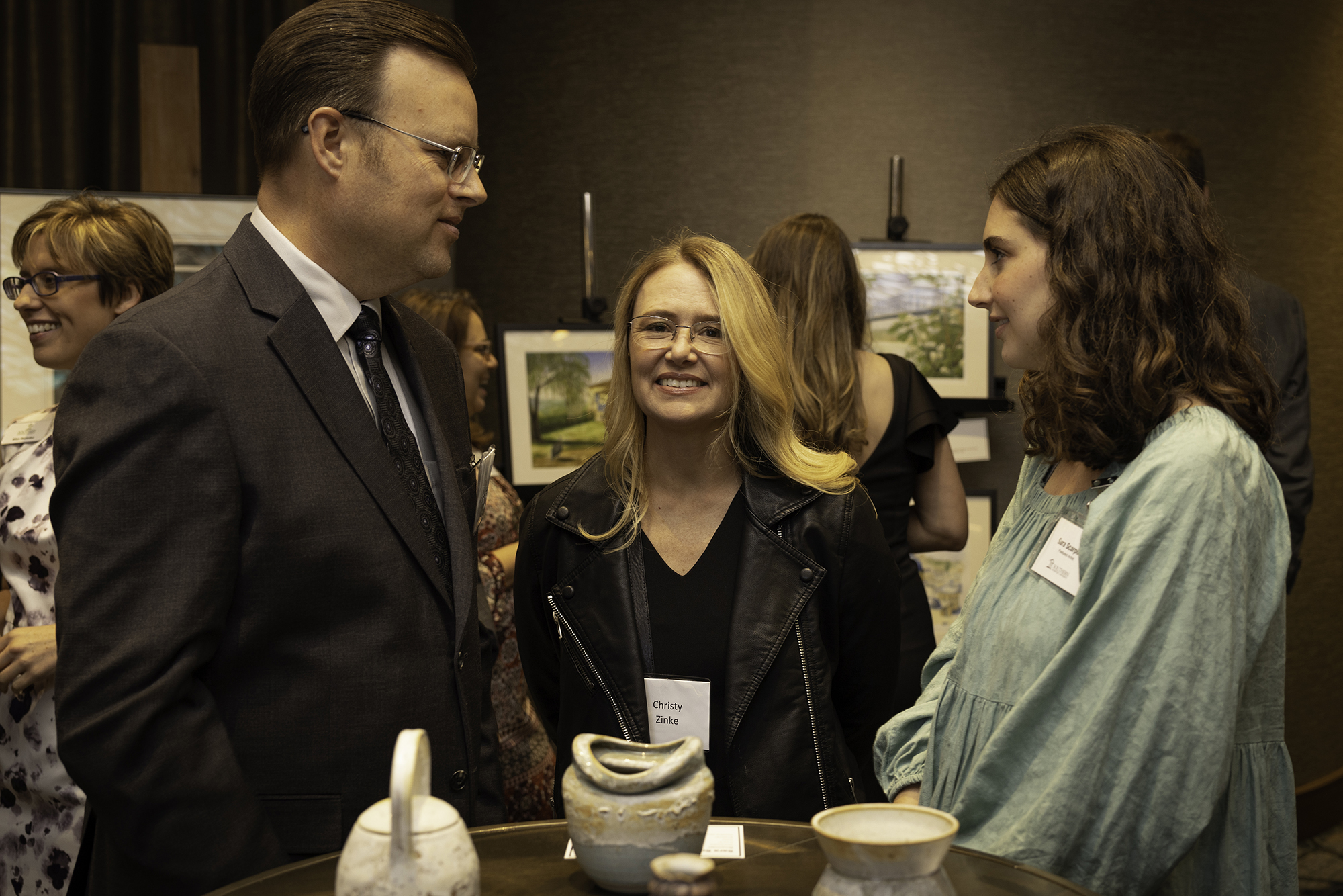 three people talking