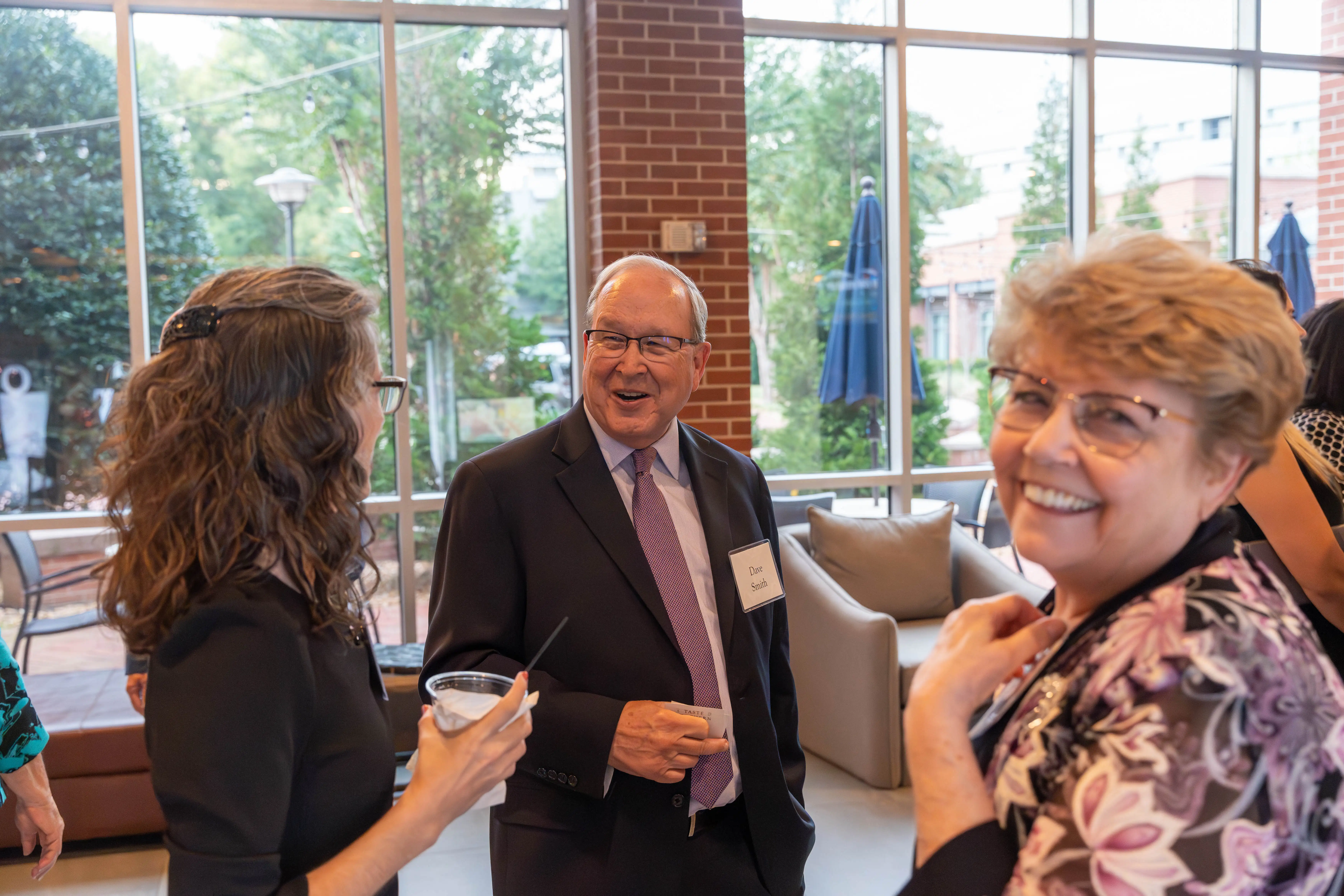 Janell Hullquist, '05, David Smith, and Cherie Smith, '91