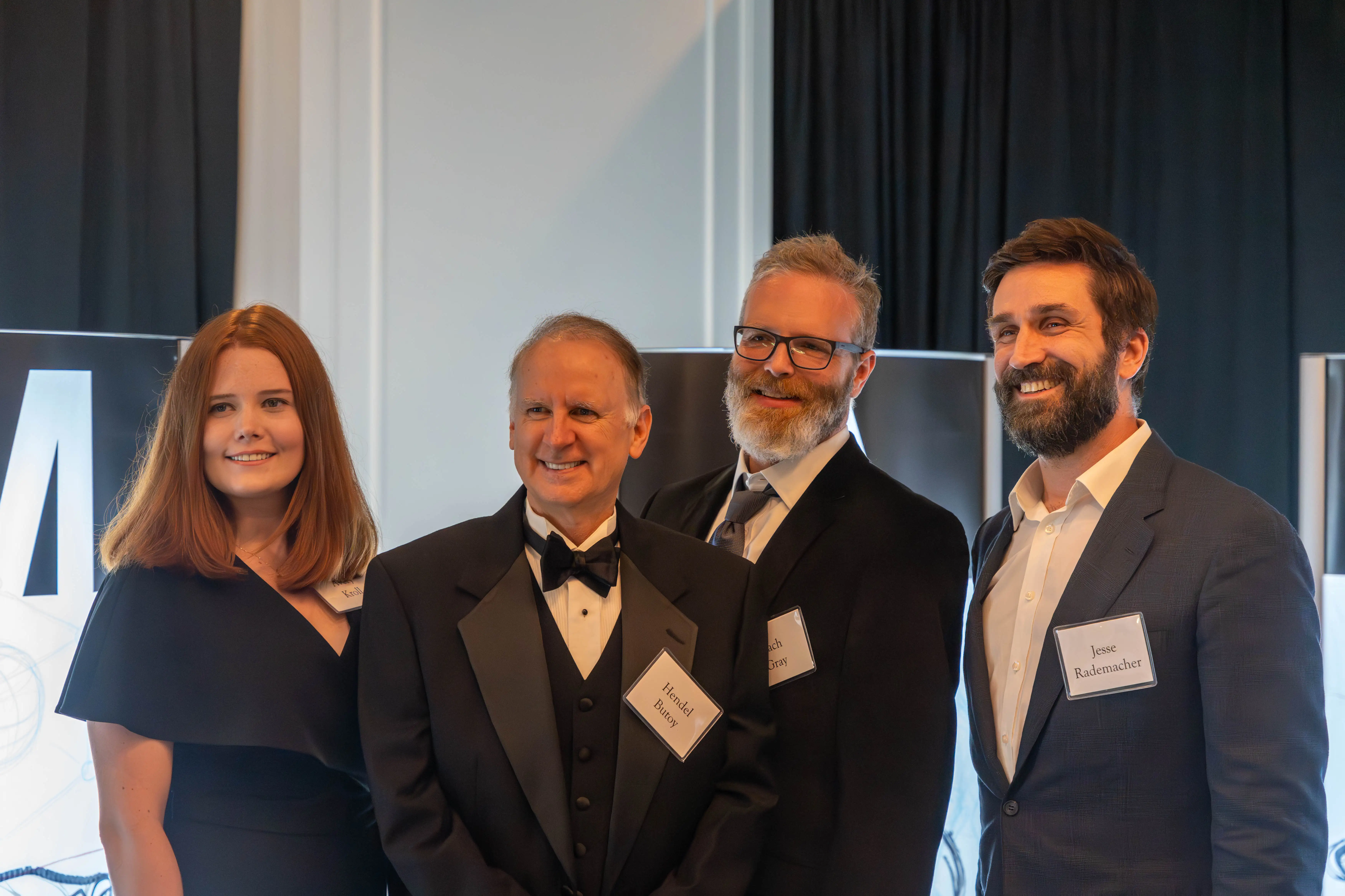 Avery Kroll, '22, Hendel Butoy, Zach Gray, '99, and Jesse Rademacher, '01