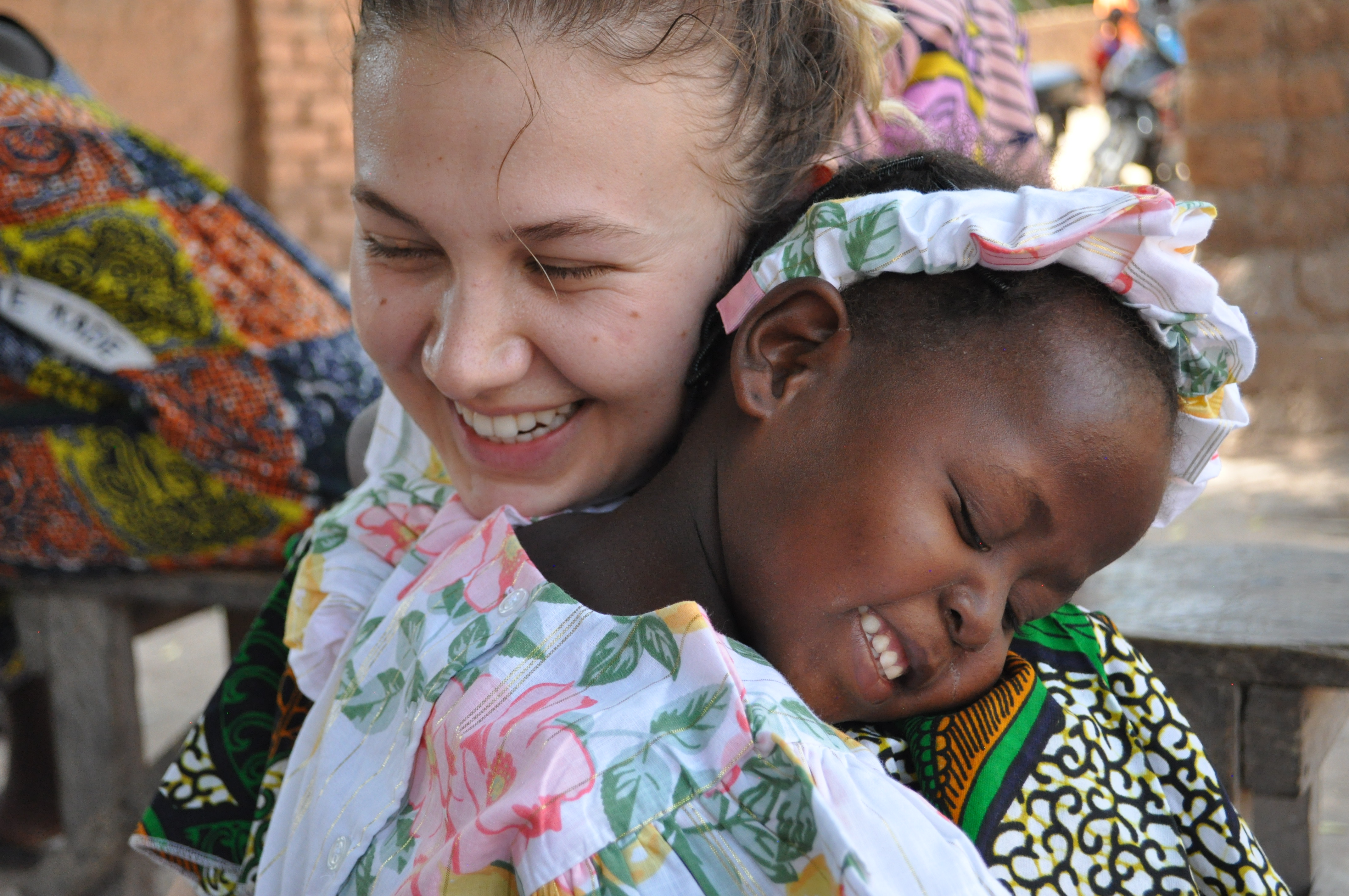 Katie Hamilton in Africa with a local girl
