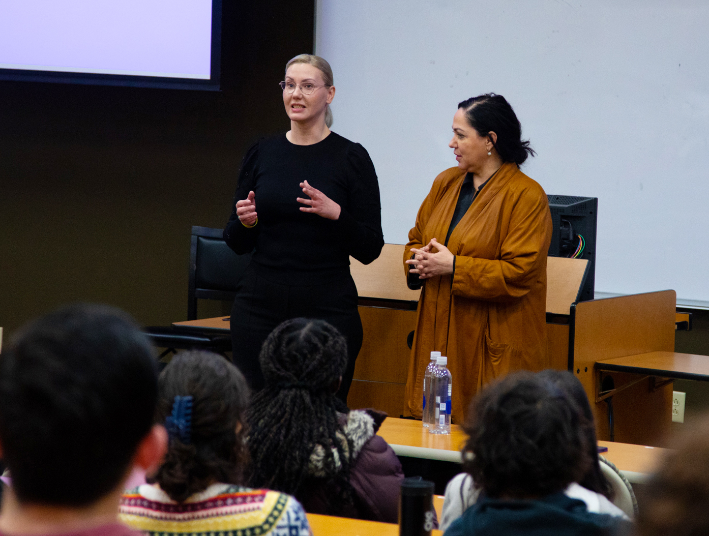 Two female Ukrainian delegates speak to a classroom of students at Southern Adventist University