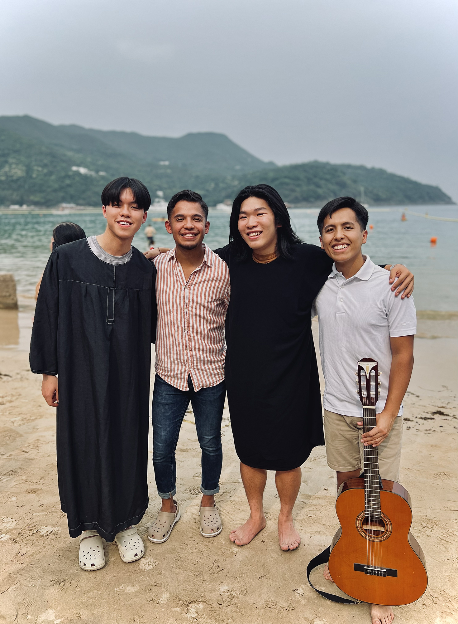 Southern theology majors Edvan Benitez (second from left) and Mauricio Jaldin (right)                                     were thrilled to help lead a number of classmates to Jesus while serving as student missionaries at Hong Kong Adventist College.