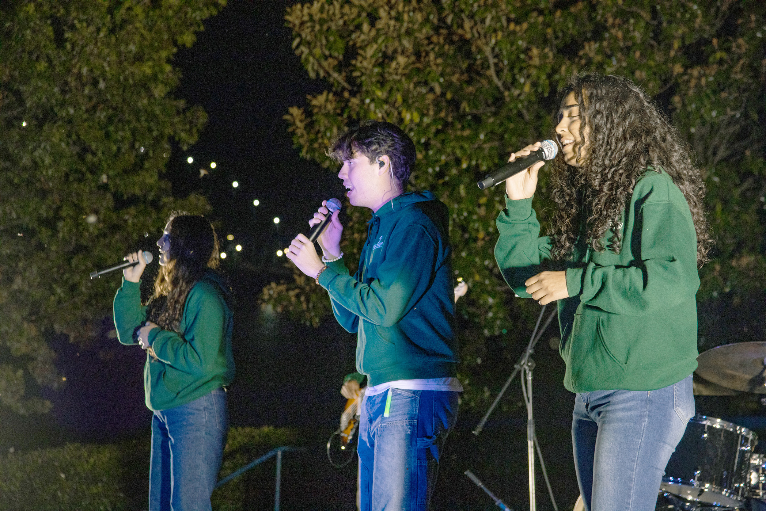 Students sing at Glow Night of Worship
