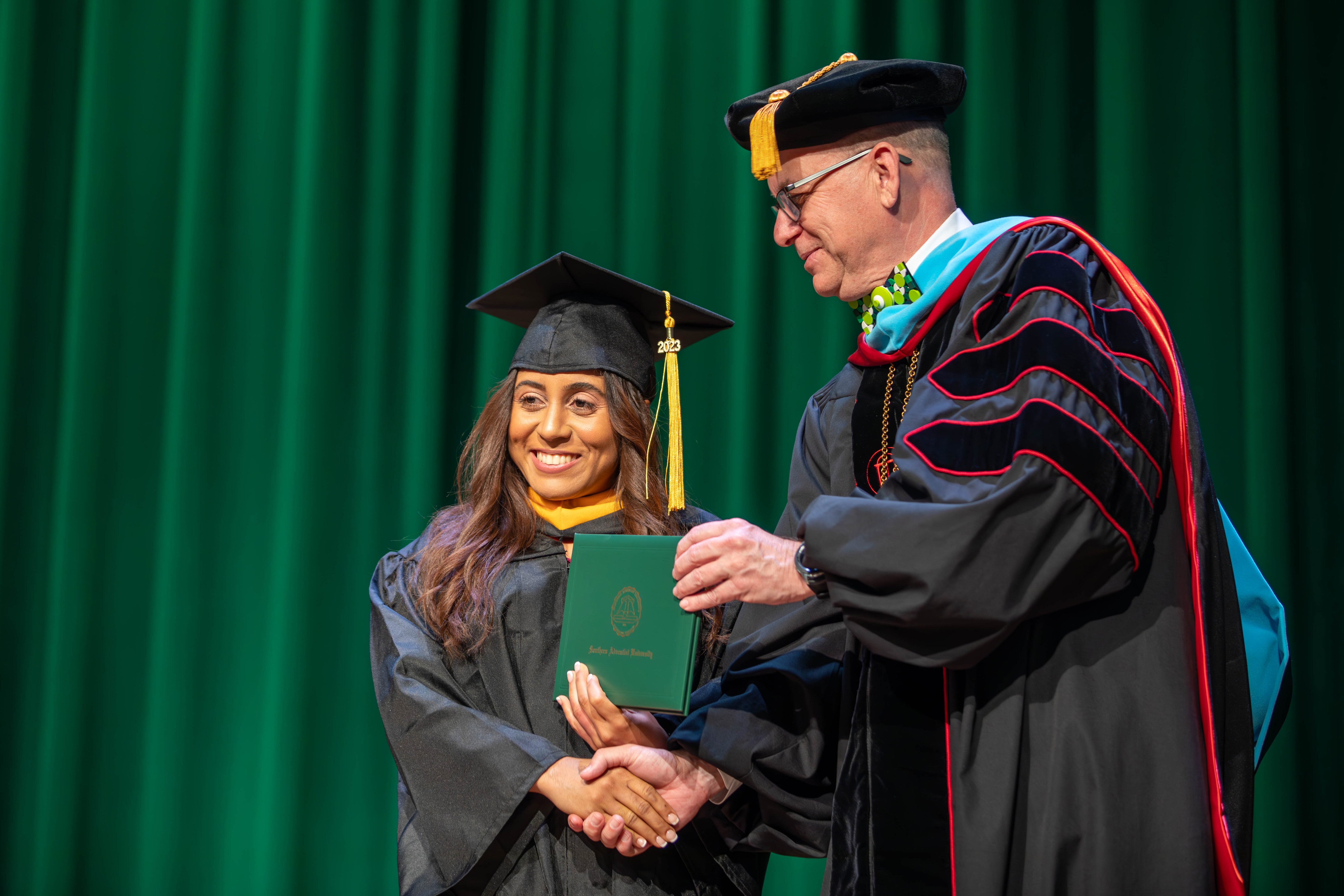 Ambar DeLeon receives her diploma.