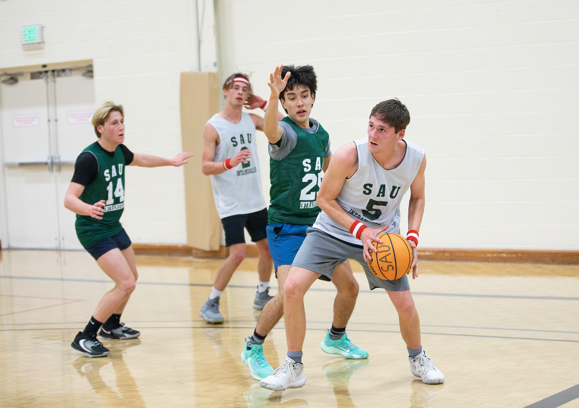 Students playing basketball during Southern Intramurals season