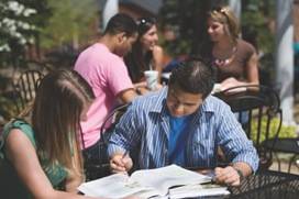 Two students studying at a table.
