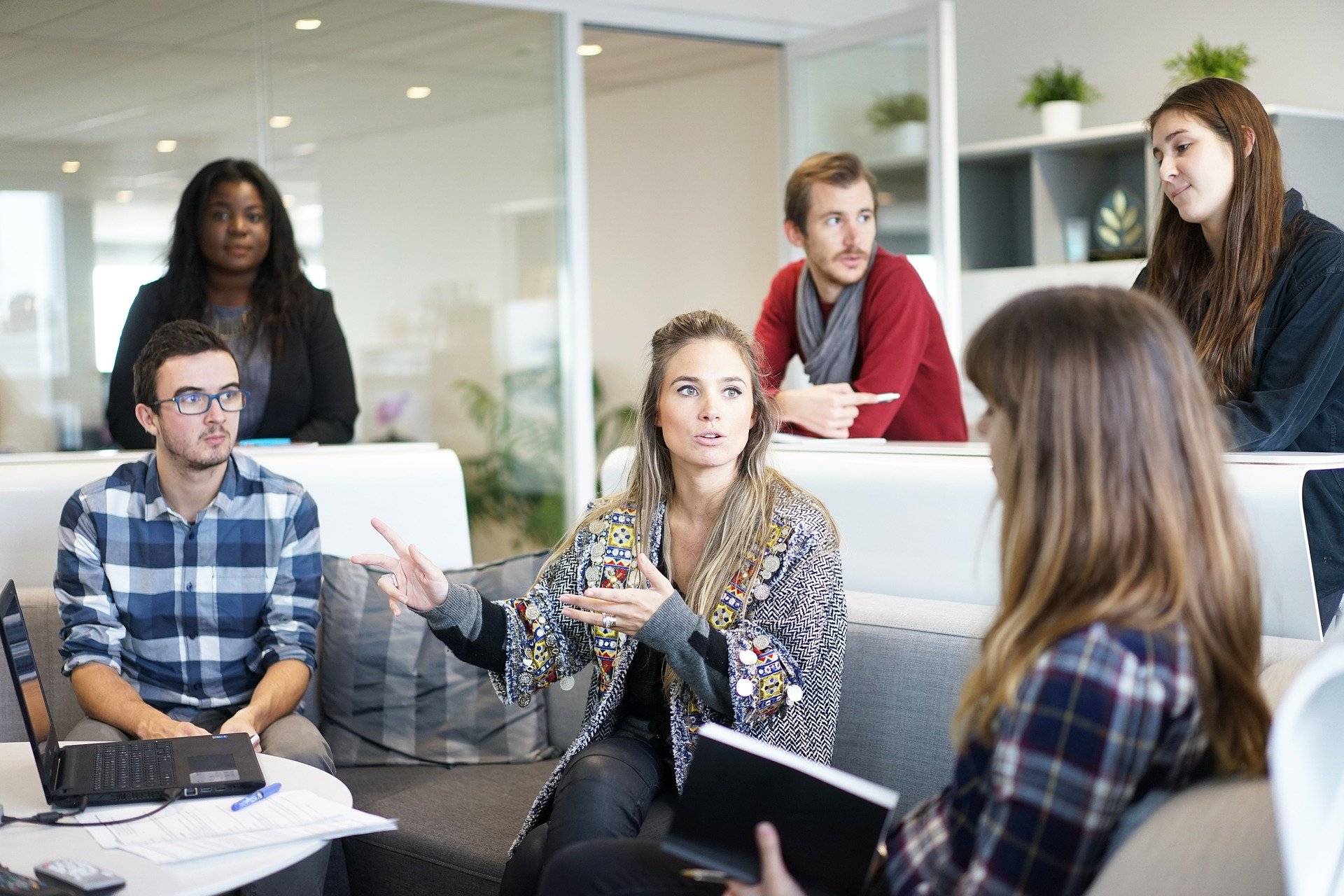 Group of men and women in a discussion.
